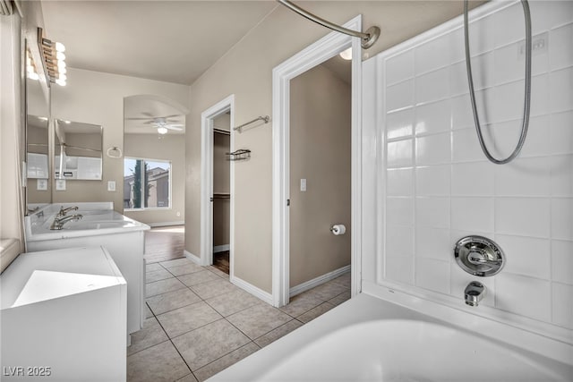 bathroom featuring vanity, tile patterned flooring,  shower combination, and ceiling fan