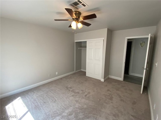 unfurnished bedroom featuring carpet floors, a closet, and ceiling fan