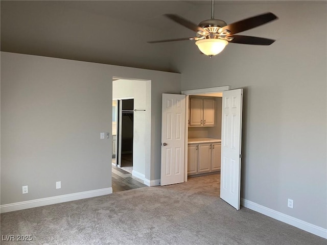 unfurnished bedroom with ceiling fan and light carpet