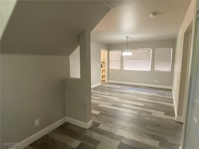 interior space featuring a notable chandelier and hardwood / wood-style flooring