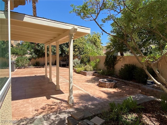 view of patio / terrace with an outdoor fire pit