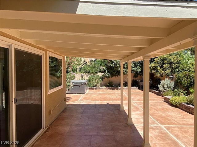 view of patio / terrace featuring a hot tub