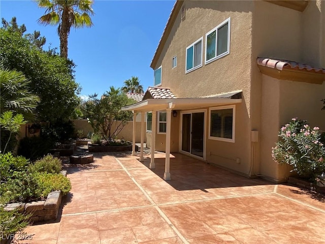 back of property featuring a patio