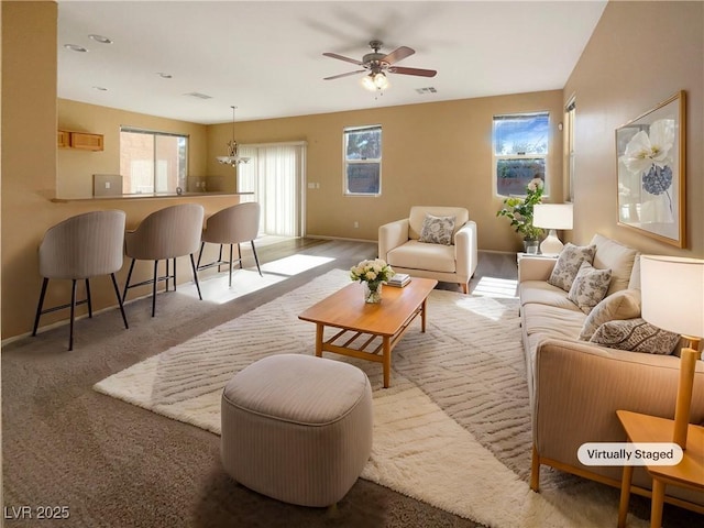 living room featuring light carpet and ceiling fan