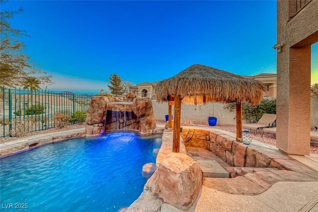 view of swimming pool featuring a gazebo and pool water feature