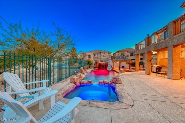 view of swimming pool featuring an in ground hot tub, a gazebo, and a patio