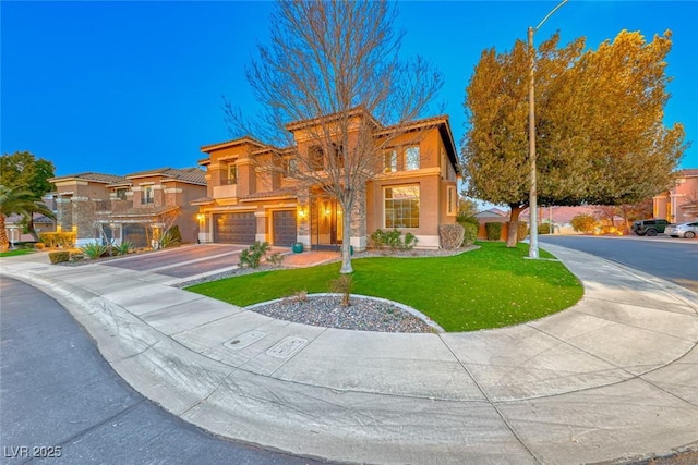 view of front of home with a garage and a front yard