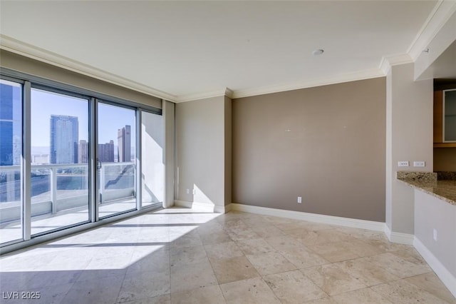 empty room featuring crown molding