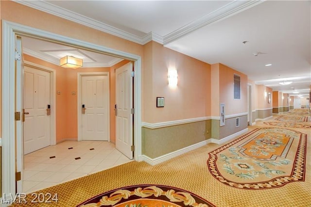 corridor with light tile patterned floors and ornamental molding