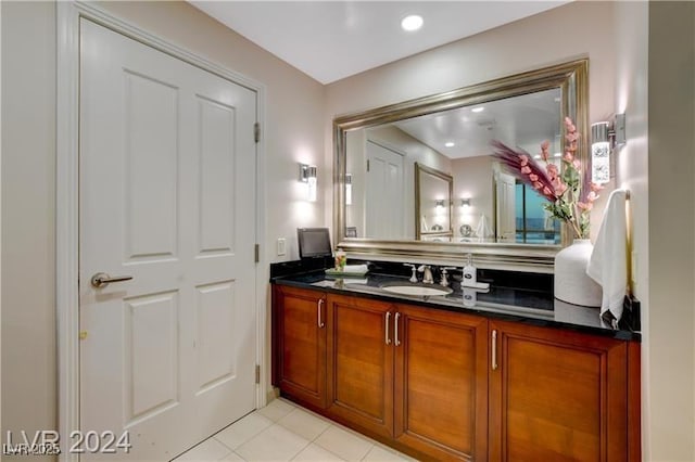 bathroom with tile patterned floors and vanity