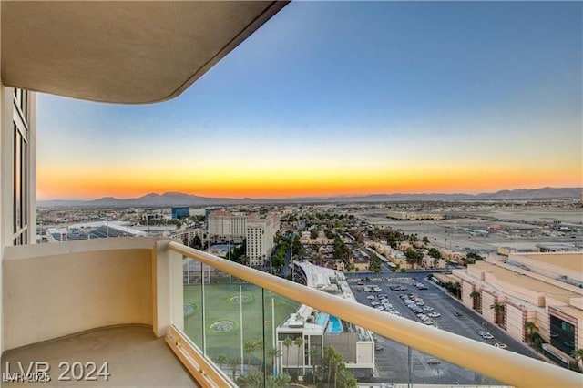 view of balcony at dusk