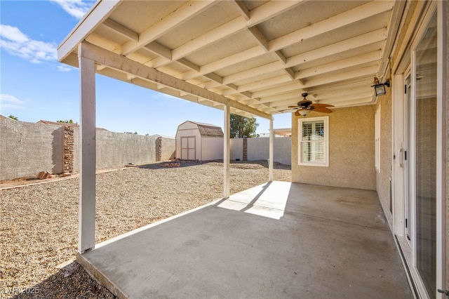 view of patio / terrace featuring ceiling fan and a shed