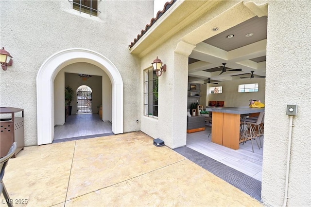 view of patio with ceiling fan