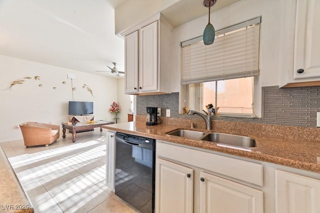 kitchen featuring pendant lighting, black dishwasher, sink, and backsplash