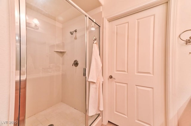 bathroom with a shower with shower door