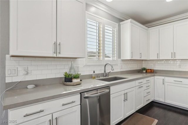 kitchen with sink, stainless steel dishwasher, decorative backsplash, and white cabinets