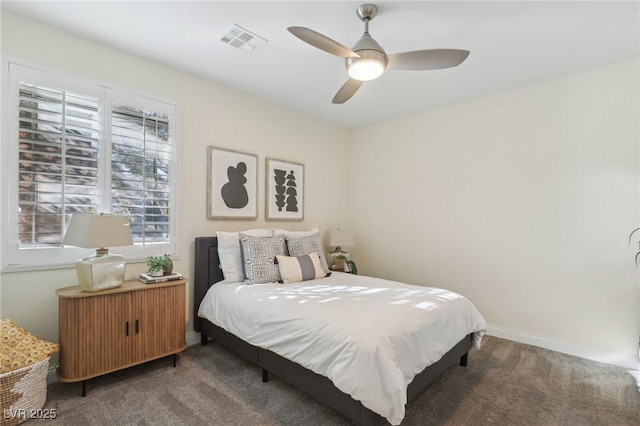 carpeted bedroom with ceiling fan and radiator heating unit