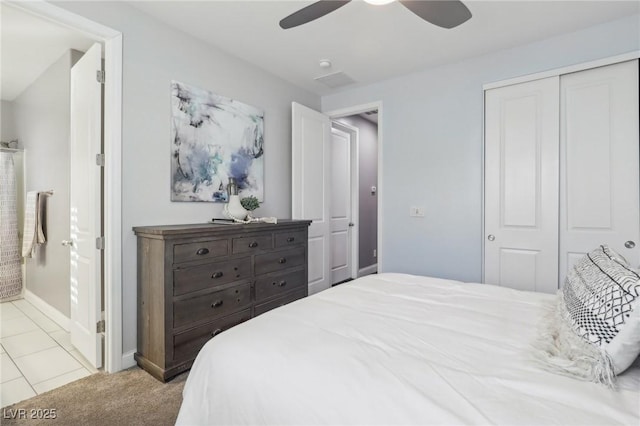 carpeted bedroom with a closet and ceiling fan