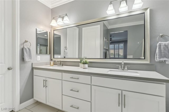 bathroom featuring crown molding, tile patterned flooring, and vanity