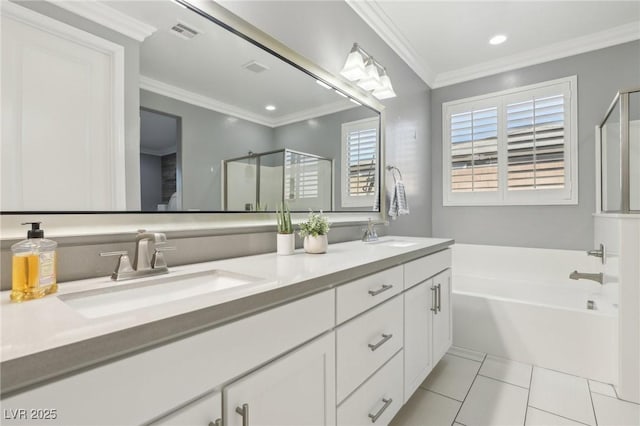 bathroom featuring vanity, tile patterned floors, separate shower and tub, and crown molding