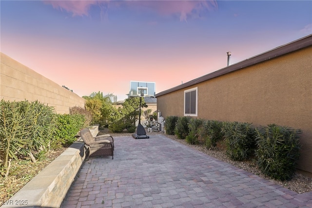 view of patio terrace at dusk