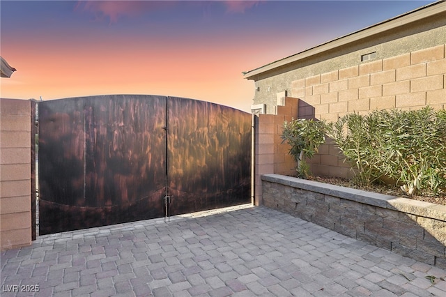 view of gate at dusk