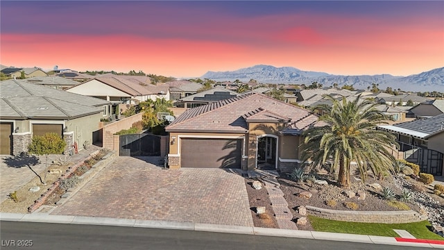 single story home featuring a mountain view and a garage