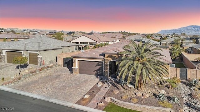 view of front of home featuring a garage and a mountain view