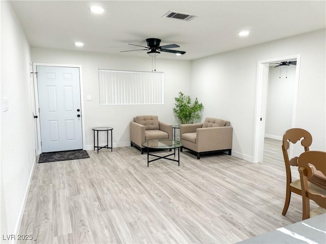 interior space with light wood-type flooring and ceiling fan