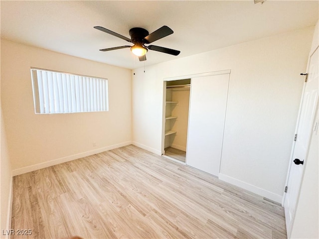 unfurnished bedroom featuring a closet, ceiling fan, and light wood-type flooring