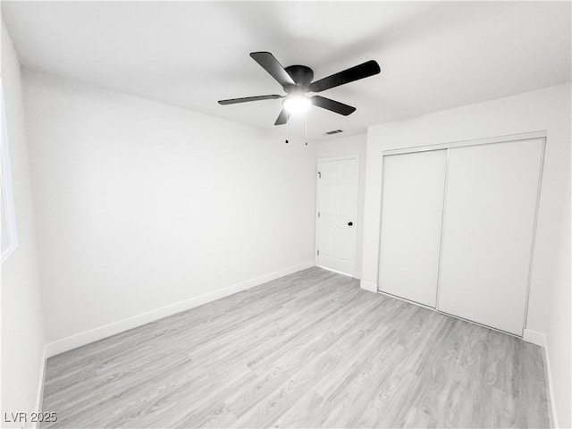 unfurnished bedroom featuring a closet, ceiling fan, and light hardwood / wood-style floors