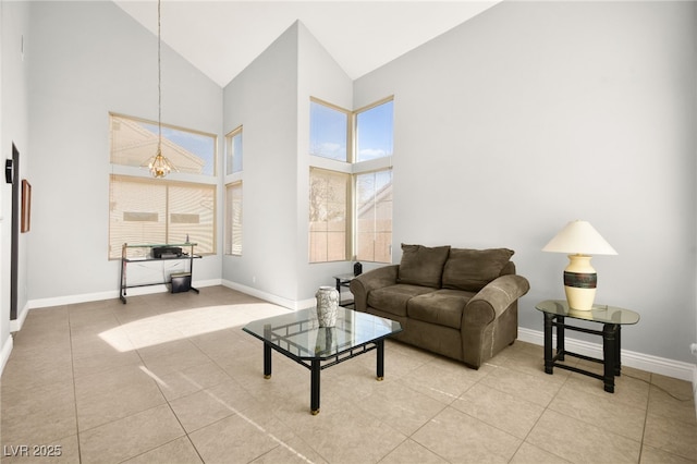 tiled living room with plenty of natural light and high vaulted ceiling