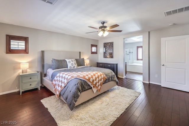 bedroom featuring ceiling fan, dark hardwood / wood-style flooring, and ensuite bath