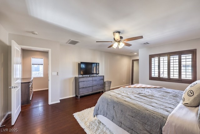 bedroom featuring ceiling fan and dark hardwood / wood-style flooring