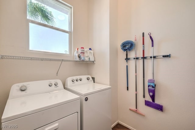 clothes washing area with separate washer and dryer