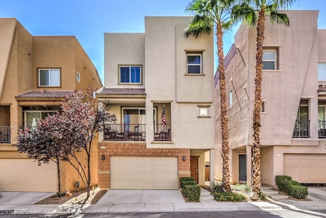 view of front of property featuring a garage and a balcony