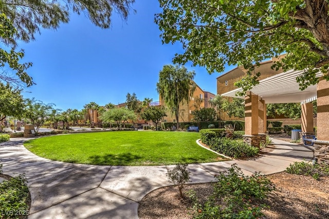 surrounding community with a pergola and a lawn