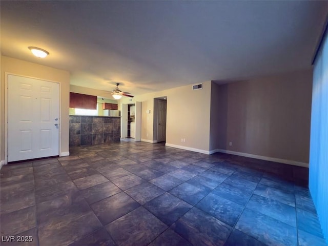 unfurnished living room with ceiling fan