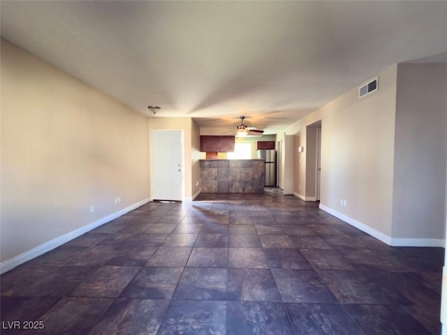 unfurnished living room featuring ceiling fan