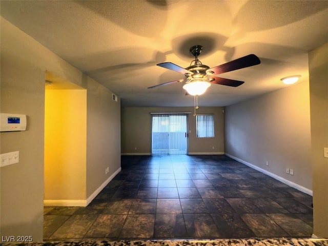 empty room featuring ceiling fan