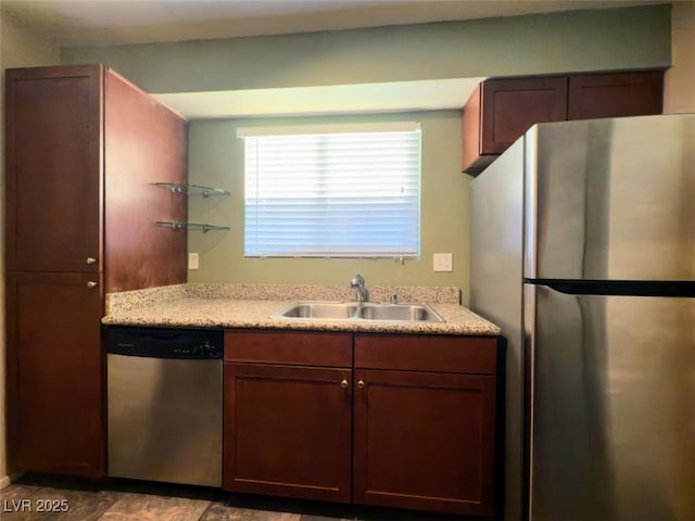 kitchen with sink and appliances with stainless steel finishes