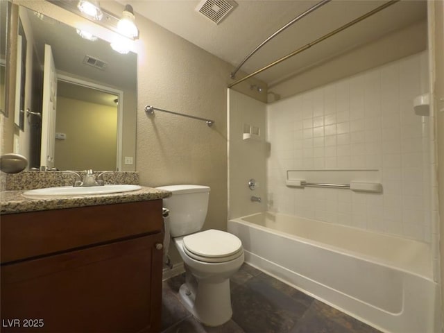 full bathroom with vanity, toilet, and tiled shower / bath