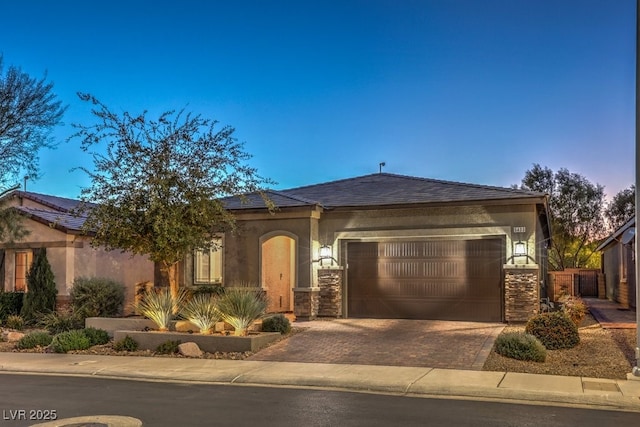 view of front of property with a garage