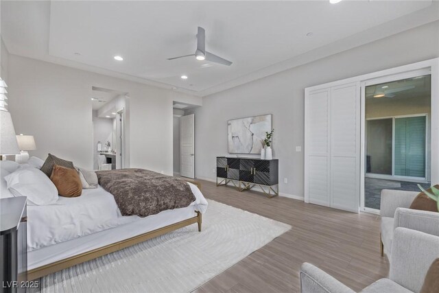 bedroom with baseboards, ceiling fan, wood finished floors, and recessed lighting