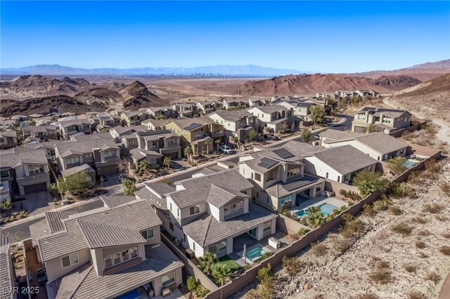 drone / aerial view with a residential view and a mountain view