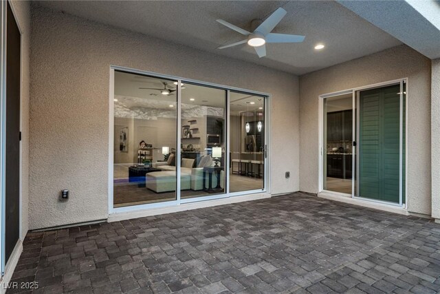 view of patio featuring a ceiling fan