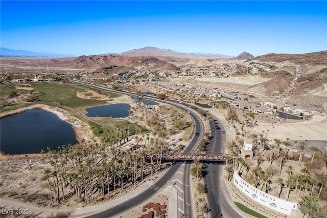 bird's eye view with a water and mountain view