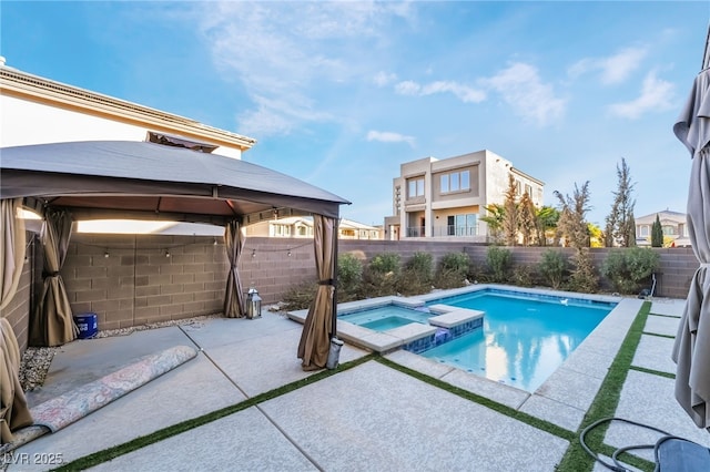 view of swimming pool featuring an in ground hot tub, a patio, and a gazebo