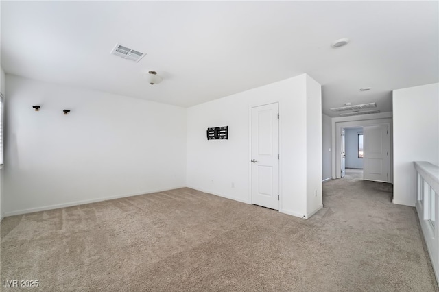 empty room with light colored carpet