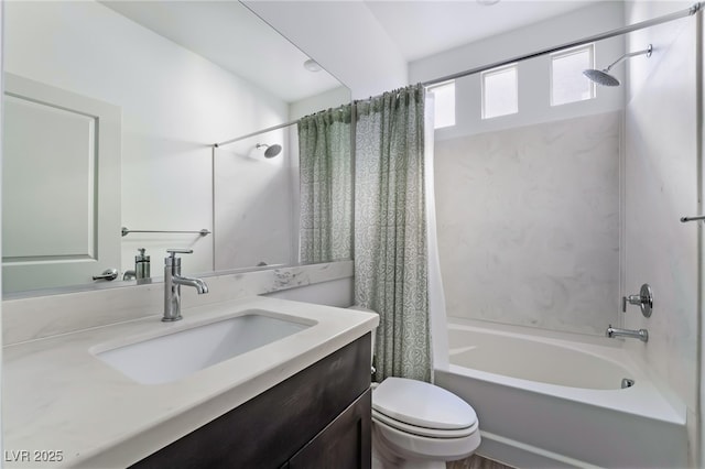 full bathroom featuring shower / tub combo with curtain, vanity, and toilet